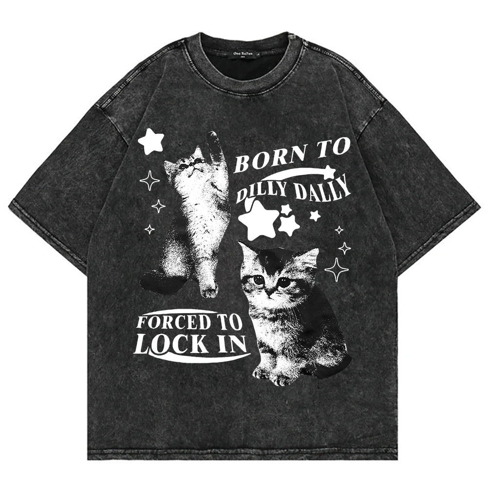 Acid‑wash black tee with two chaotic‑cute cats and ‘Born to Dilly Dally, Forced to Lock In’ graphic — alt aesthetic gremlin gift